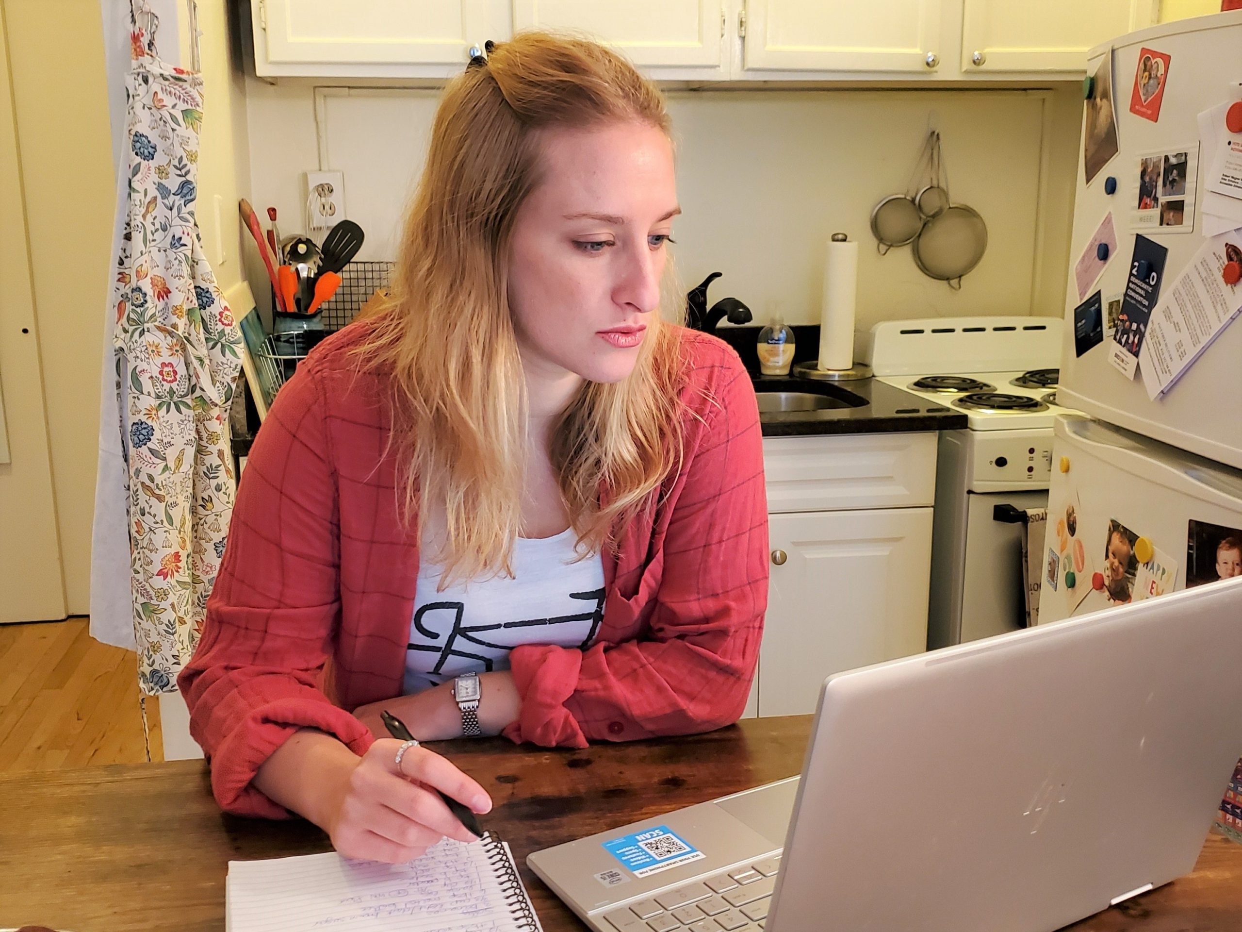 joey rockman sitting in the kitchen working on her computer