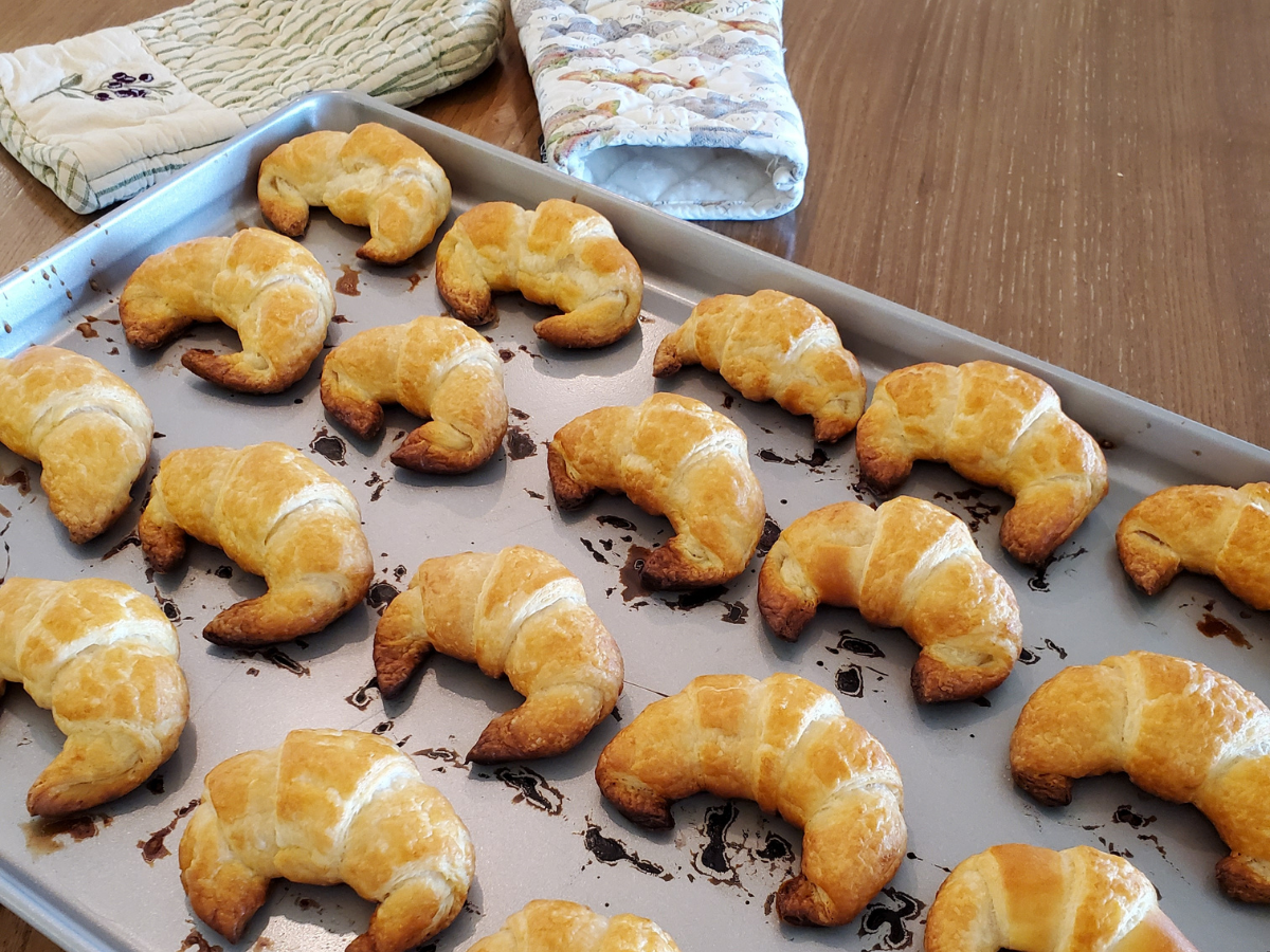 croissants on a baking sheet fresh out of the oven